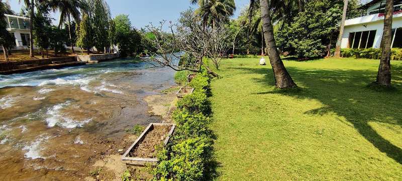 12 months flowing River Touch 4 Acre Ready Farmhouse for sale in Karjat.