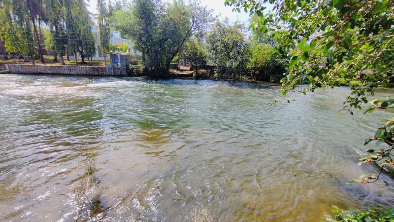 12 months flowing River Touch 4 Acre Ready Farmhouse for sale in Karjat.